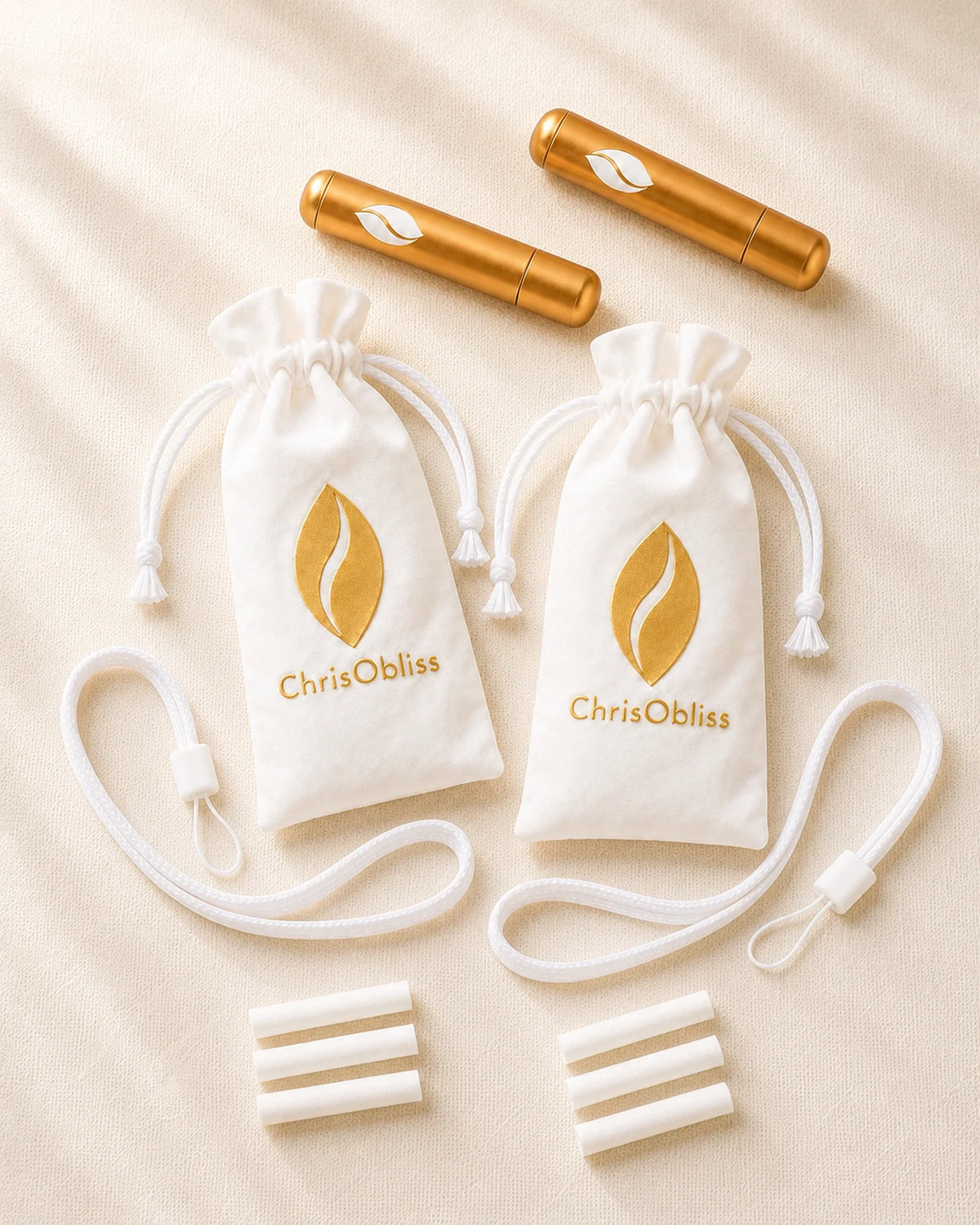 The Presence Anchor Pair: two gold inhalers, two white pouches, two carrying cords and six dry cotton sticks.